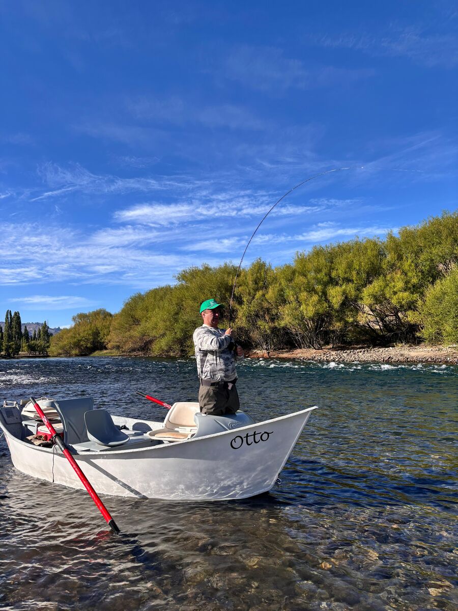 Angler fighting a fish from the drift boat
